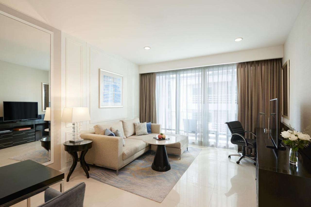 Dusit Suites Hotel Ratchadamri, Bangkok Exterior foto A living room in a serviced apartment in Singapore