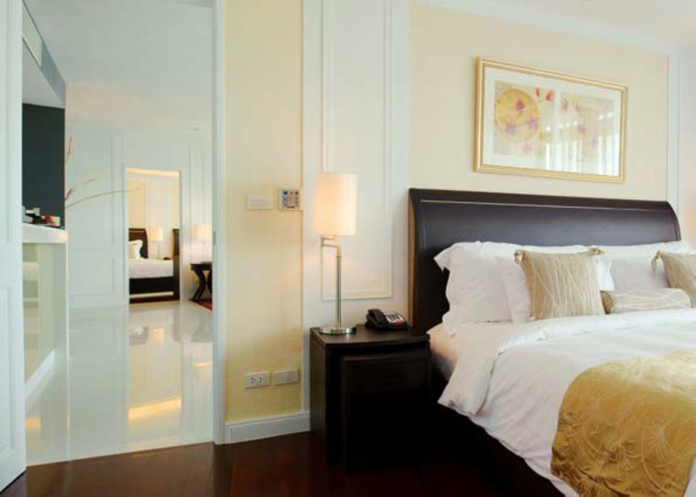 Dusit Suites Hotel Ratchadamri, Bangkok Exterior foto A bedroom at the hotel